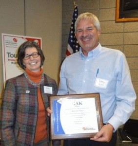 Karen Conroy Presents Pi Alpha Kappa Award to Dave Bade