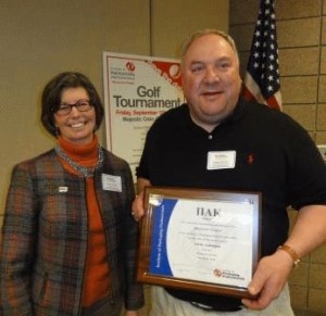 Karen Conroy presents Pi Alpha Kappa Award to Greg Johnson