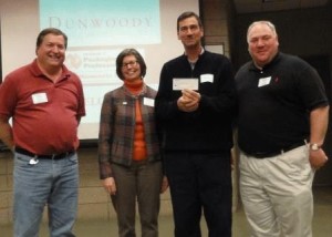 Mike Beck, Karen Conroy, Greg Johnson present check to HTC's Tom Gillespie